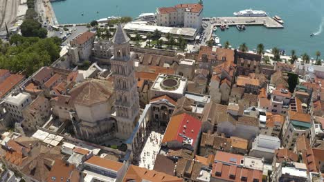 Aerial-View-Of-Old-City-Of-Split-And-The-View-of-Old-Bell-Tower-In-Croatia---drone-shot