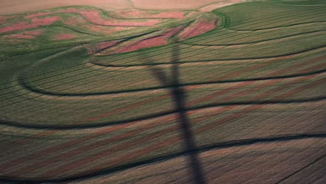 Shadow-of-a-moving-wind-turbine-recorded-with-drone