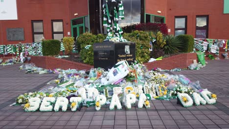 Wide-shots-of-family-wreaths-left-for-Celtic-great,-Bertie-Auld-at-Parkhead
