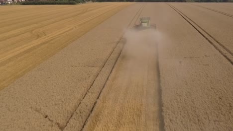 Harvest-drone-flies-through-crop-dust-then-over-Claas-machine