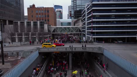 Crowd-marching-on-street-closing-in-to-bridge-Calgary-Protest-12th-Feb-2022