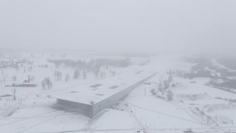 Drone-shot-of-Estonian-national-museum-during-snowing-ERM