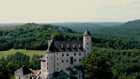 Bobolice-medieval-castle-in-a-green-land-landscape-aerial-view