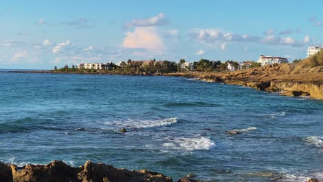 Coastline-of-Paphos,-Cyprus-during-a-blue-sky-partially-cloudy-day