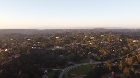 Town-of-Prunedale-surrounded-by-beautiful-nature,-aerial-drone-above-view