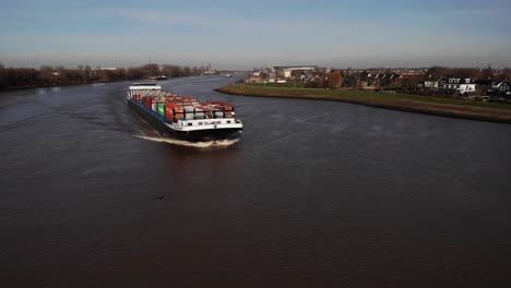 View-Of-Missouri-Cargo-Ship-Approaching-And-Travelling-Along-River-Noord