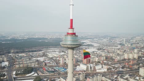 AERIAL:-City-of-Vilnius-with-TV-Tower-and-Waving-Lithuanian-Flag