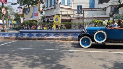 A-vintage-car-is-passing-on-the-Kolkata`s-street-on-a-Vintage-car-rally-in-Kolkata,-India