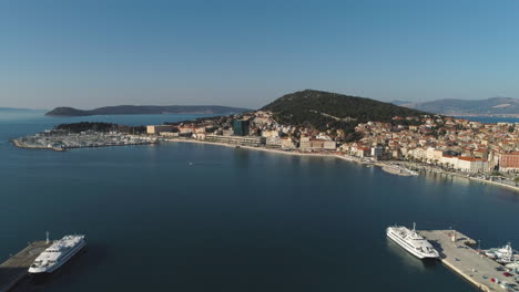 Aerial-View-Over-The-Historic-Port-Of-Split,-Croatia-With-Ferries
