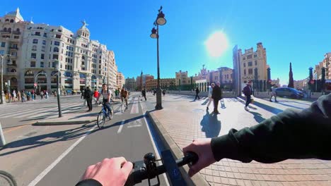 Commuting-on-rental-cycle-near-Plaza-de-Toros-de-Valencia-Spain