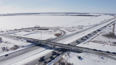 Aerial-of-freedom-convoy-2022-shows-packed-highway-and-overpass-with-supporters