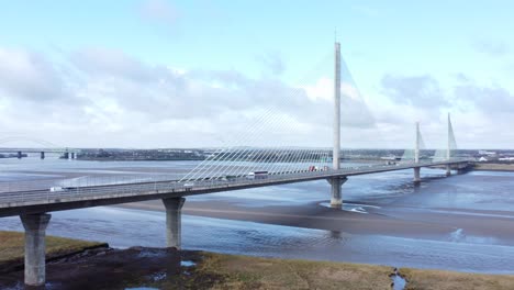 Mersey-gateway-landmark-aerial-view-above-toll-suspension-bridge-river-crossing-zoom-out-to-wide-shot