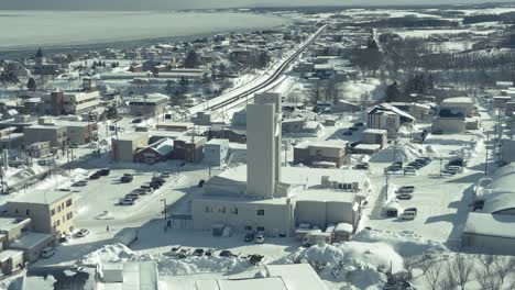 Aerial-Winter-Snow-View-Of-Okhotsk-Sea-Tower-In-Omu,-Hokkaido