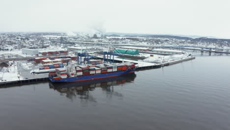 Winter-aerial-view-of-a-cargo-shipped-docked-in-the-Port-of-Saint-John,-New-Brunswick
