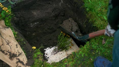Person-With-Shovel-Covers-The-Pit-With-Earth