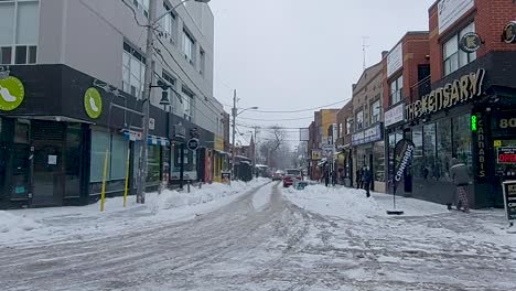 Quiet-Kensington-Avenue-during-snowfall,-downtown-Toronto