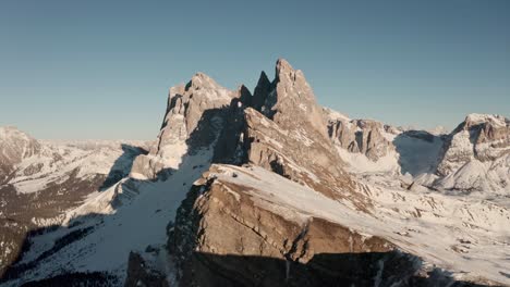 Low-cinematic-drone-shot-towards-Seceda-mountain-ridge-in-the-Dolomites