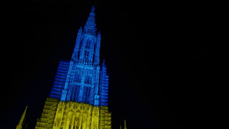 Camera-panning-right-revealing-the-Ulmer-Münster-lit-in-the-colors-of-Ukraine-due-to-the-ongoing-war