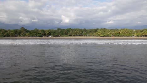 The-long-and-sandy-coastline-of-Quepos-beach-on-Damas-Island,-Costa-Rica
