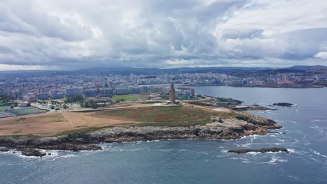 Drone-Aerial-Top-notch-view-Tower-of-Hercules,-on-the-coast-of-La-Coruña,-northern-Spain,-Galicia