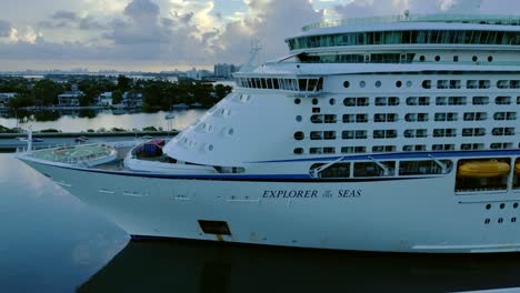 Explorer-of-the-Seas-Cruise-ship-sailing-from-port-in-Miami-video-background-|-Huge-cruise-ship-sailing-from-port-front-view-video-background-in-4K