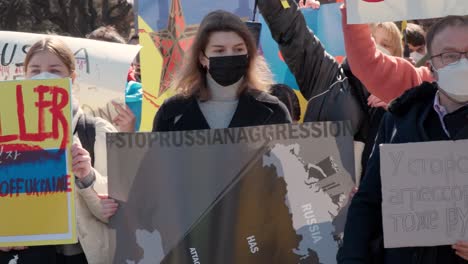 Ukrainian-people-in-Seoul-protesting-against-Putin-And-the-Russian-war-in-front-of-the-embassy-holding-banners-"Putin's-hands-in-blood"-and-"hands-off-Ukraine
