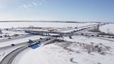 Aerial-over-onramp-showing-supporters-and-highway-with-freedom-convoy-truckers-and-supporters
