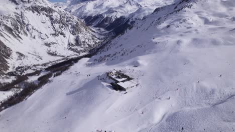 Top-Down-View-of-Ski-Resort-and-Ski-Slope---Truck-Shot-and-Panning-Shot---Shot-in-Tignes-and-Val-d'Isere