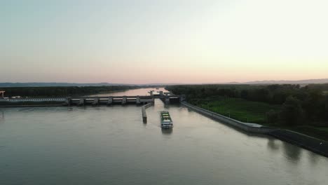 A-cruise-ship-navigating-out-of-a-lock-on-the-Danube-in-Austria