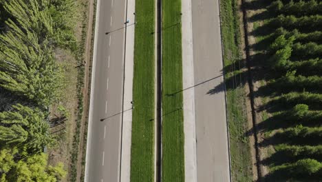 Aerial-view-over-a-road-in-the-countryside-surrounding-areas-of-General-Roca,-Cordoba,-Argentina