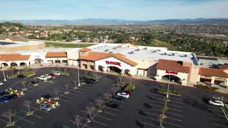 Aerial-Above-TJ-Maxx-Department-Store-Building-Front-And-Parking-Lot-In-America