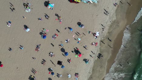 Crowded-Beach-And-The-Sea---aerial-top-down