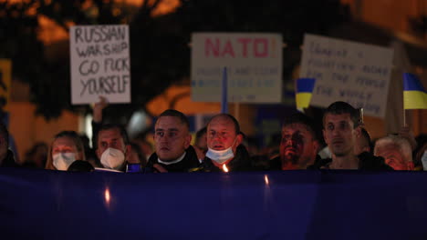 Crowded-People-Wearing-Mask-Gathered-During-Prayer-Vigil-For-Peace-In-Ukraine,-Held-In-Leiria,-Praca-Rodrigues-Lobo,-Portugal