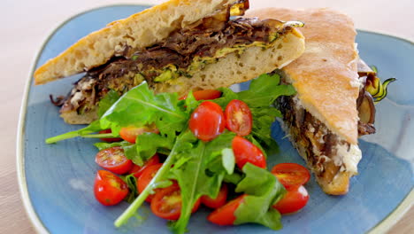 Delicious-Ciabatta-Sandwich-Bread,-Grilled-Eggplants,-Zucchini-And-Cherry-Tomatoes-On-Plate