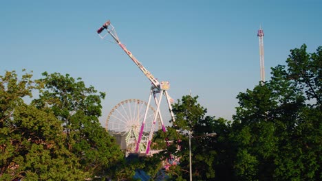 Swing-Ride,-Ferris-Wheel-and-Free-Fall-Tower-Scenic-overview-on-a-clear-sunny-day