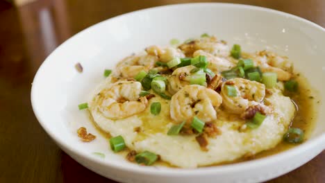 Steaming-delicious-plate-of-homemade-shrimp-and-grits-in-a-bowl-ready-to-eat---dynamic-isolated-motion