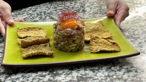 Presenting-tuna-tartare-dish-in-a-kitchen-counter