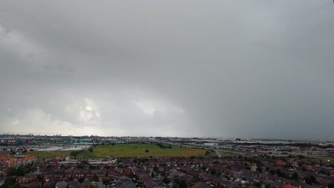 Timelapse-Of-Moody-Overcast-Grey-Clouds-Rolling-Over-Local-Town
