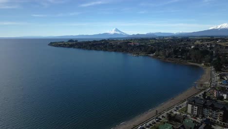 Dolly-out-aerial-view-of-Lake-Llanquihue-on-the-shores-of-the-city-of-Puerto-Varas,-Chile