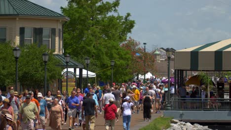 Crowds-walking-along-Mississippi-River-French-Quarter-Fest-New-Orleans