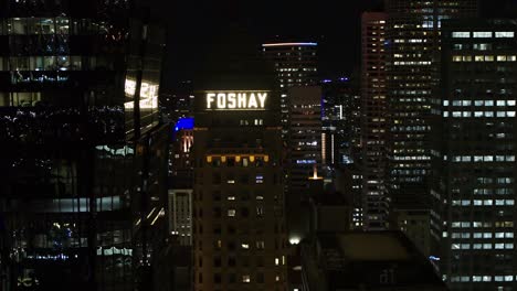 Aerial-cinematic-reveal-of-Foshay-Tower-in-downtown-Minneapolis-at-night