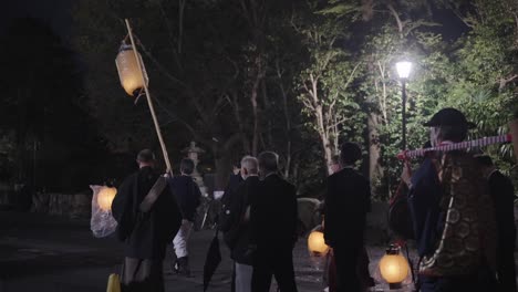 Priests-carry-lanterns-as-festivities-begin-at-Hachiman-Matsuri-Festival