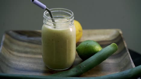 Rotating-shot-of-Aloe-Vera-smoothie-drink-mason-jar-lemon-lime