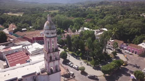 Aerial-of-picturesque-tower-of-Parish-of-Santa-Úrsula-church-in-little-town-of-Cosala,-tourist-attraction-in-Mexico