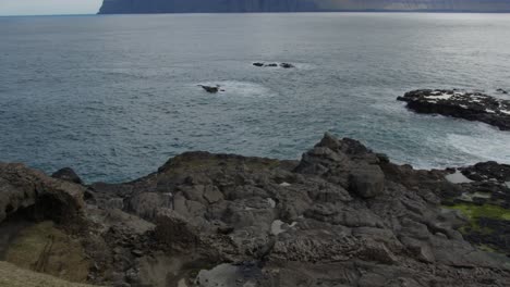 Wide-Pan-Right-of-the-Coast-in-Gjogv,-Faroe-Islands