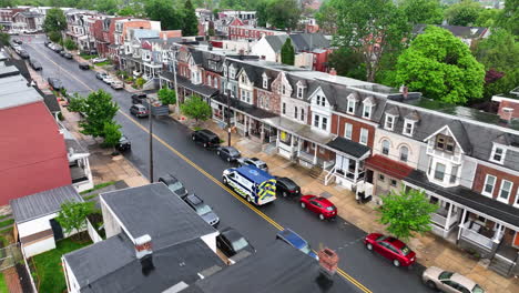 Aerial-view-of-ambulance-driving-down-city-street