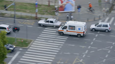 HIGH-ANGLE---An-ambulance-rushes-through-rush-hour-traffic-in-Bucharest
