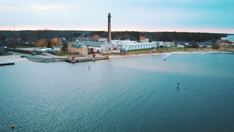 Engure,-Latvia,-23-May-2022:-Aerial-Drone-View-of-a-Corekites-Kitesurfers-Hydrofoiling-in-Engure-Port-at-in-Baltic-Sea