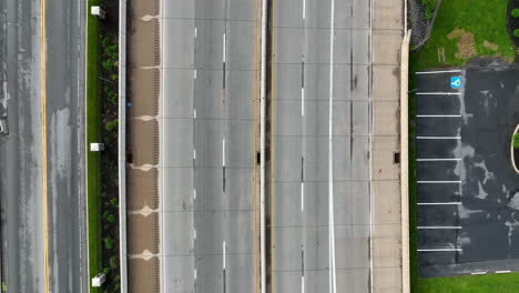 Aerial-rising-shot-of-highway-with-cars-traveling-across