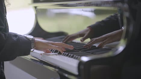 Pianist-performs-playing-a-piano.-Hands-close-up